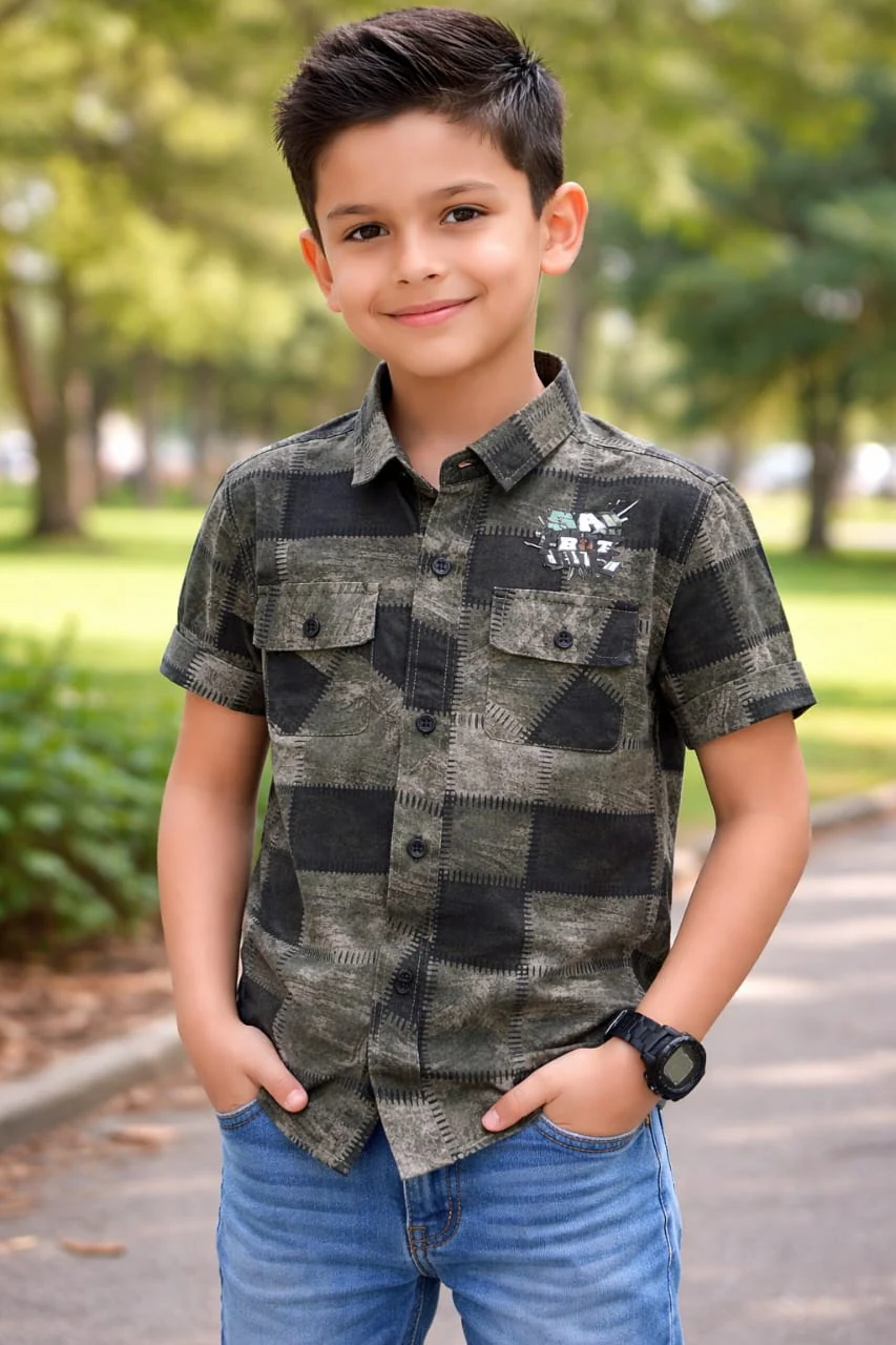 Boy modelling a patchwork print short sleeve shirt